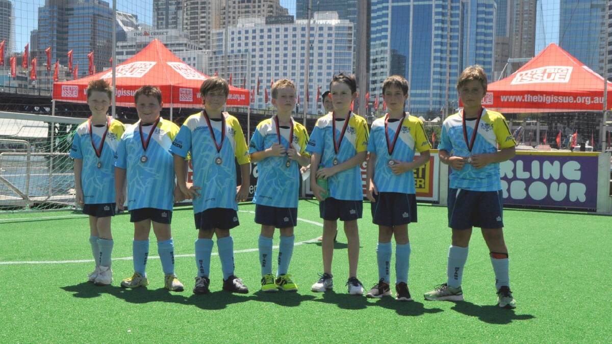   PROUD: The Stags under 9s boys with their medals, from the left: Leigh Chalker, Bailey Liggins, Jai Kinchela, Ryan Keegan, Harrison Roy, Isaac Mills, Michael Chintis. Photo: Paul Chalker 