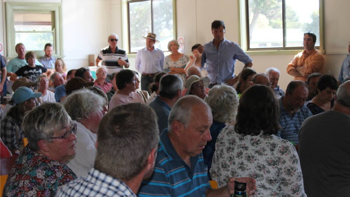  PACKED: Member for Hume Angus Taylor addresses a packed crowd at the Tarago Community Hall for a community consultation meeting on the proposed Jupiter Wind Farm to be located near the village.
