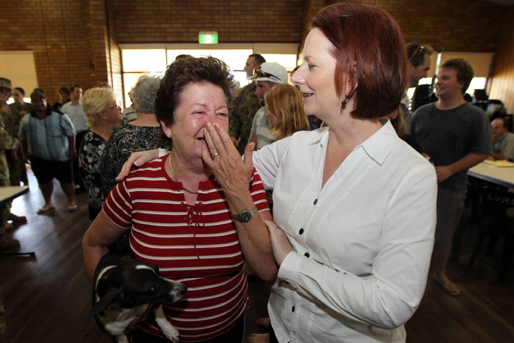 Prime Minister Julia Gillard consoles a local resident of Helidon on January 14, 2010 in Helidon, Queensland. Photo: Getty Images