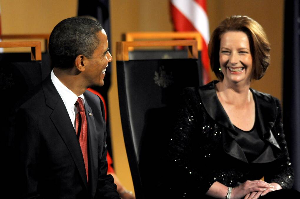 Prime Minister Julia Gillard and US President Barack Obama laugh as he is welcomed to the country on the first day of his visit to Australia, on November 16, 2011 in Canberra. Photo: Getty Images