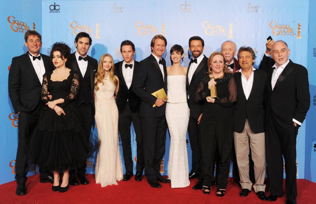 Director Tom Hooper and cast and crew of 'Les Miserables,' winner of Best Motion Picture (Musical or Comedy). Photo by Kevin Winter/Getty Images