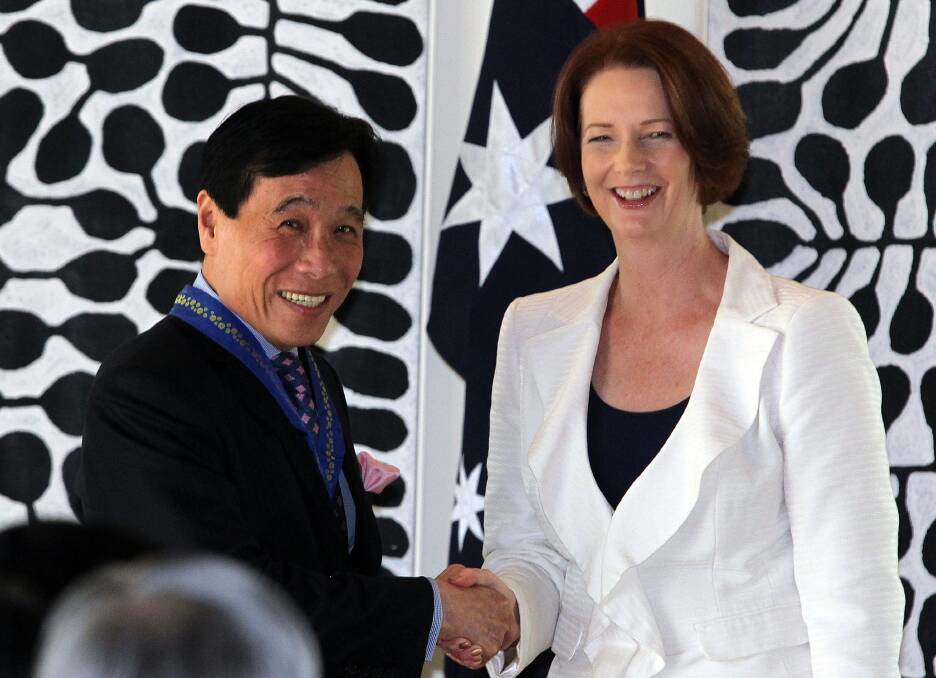 Prime Minister Julia Gillard shakes hands with Ow Chio Kiat Executive Chairman of Stamford Land Corporation during her trip to Singpore on April 23, 2012. Photo: Getty Images