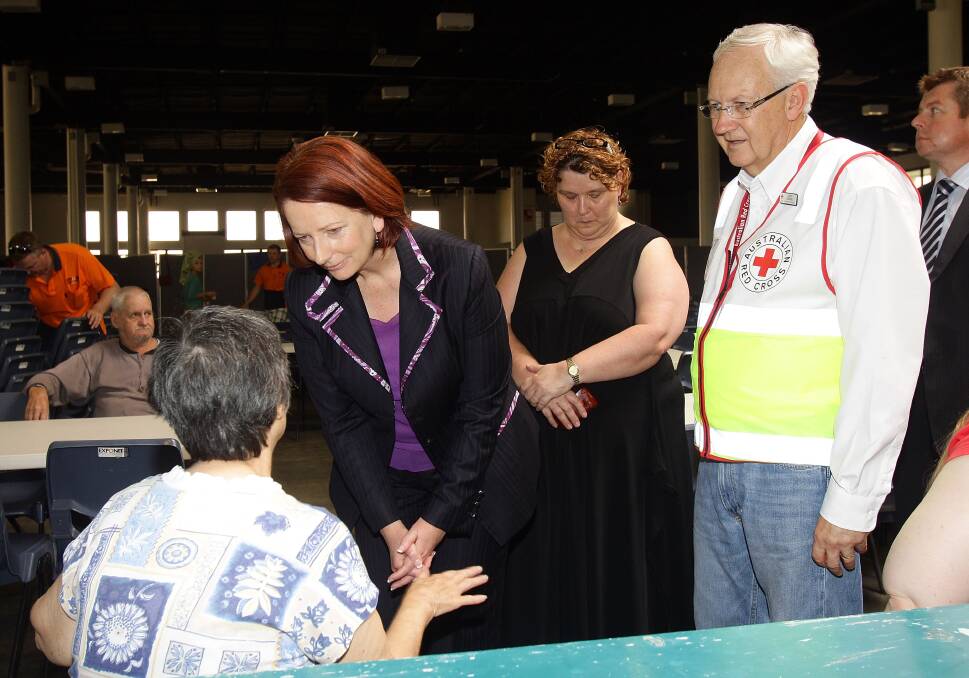 Prime Minister Julia Gillard speaks to flood victims at the evacuation centre at the RNA showgrounds on January 12, 2011 in Brisbane. Photo: Getty Images